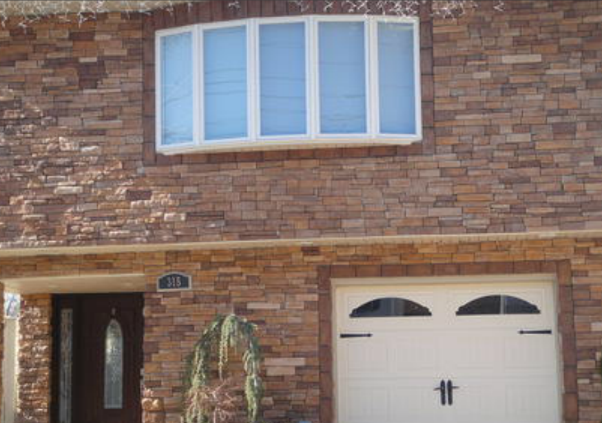 decorative residential house front with cultured stone