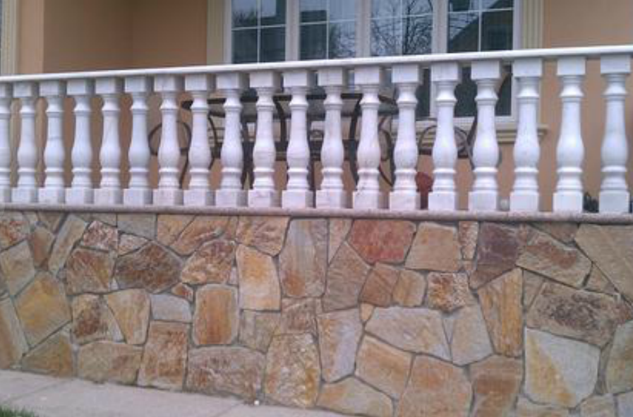 flag stone culture stone wall with railings