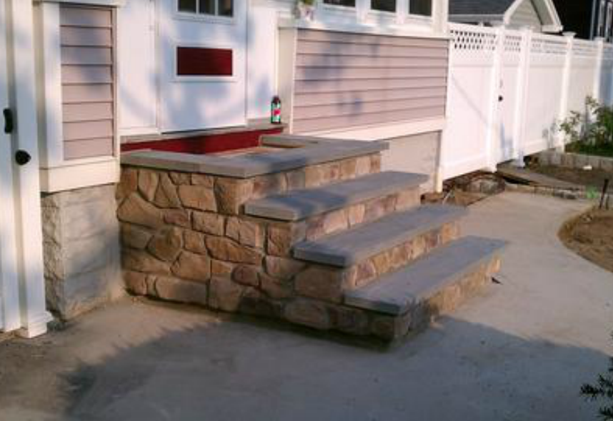 culture stone stairway outside of residential home