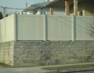 stone wall with fencing installed