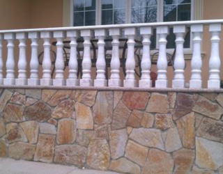 flag stone wall with decorative railings