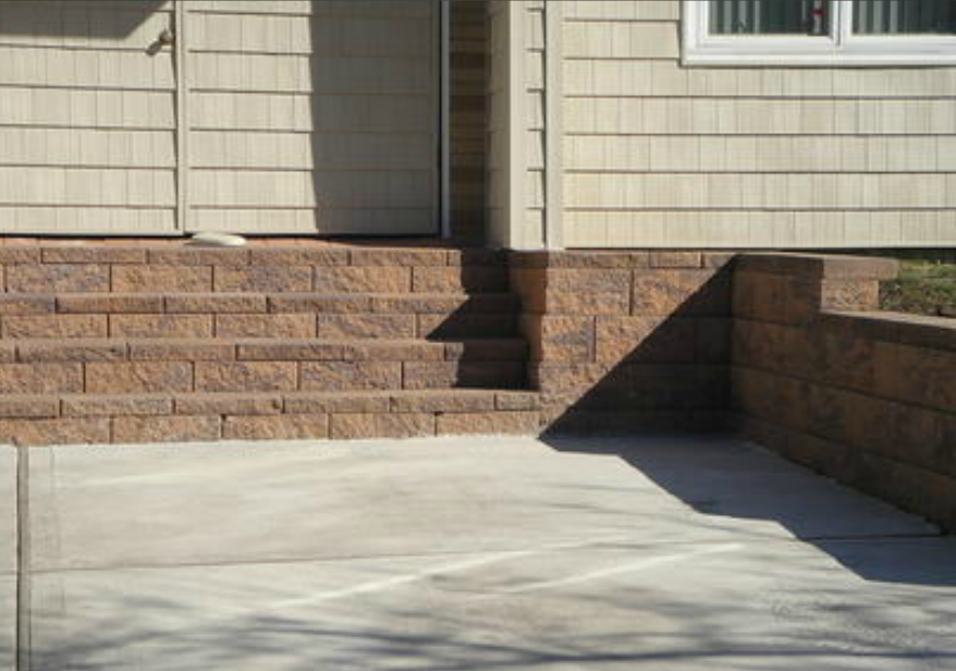 driveway with brick wall lining