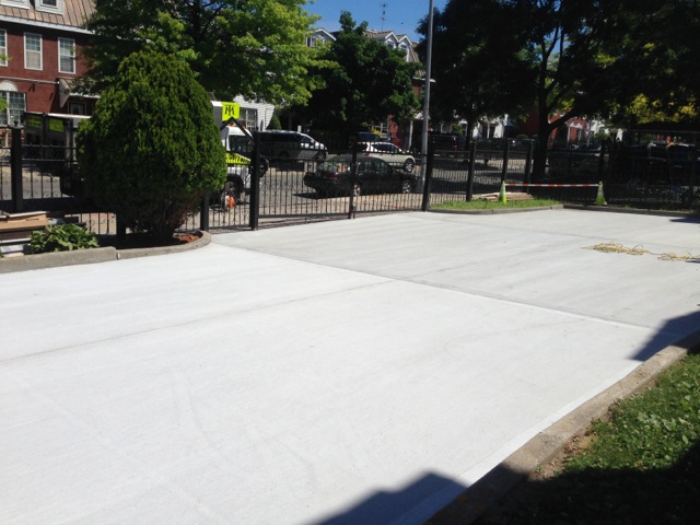 new concrete parking lot paved by pavers