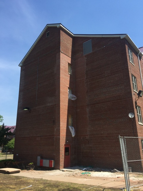 Brick installed on side of building