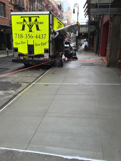 new city sidewalk paved by pavers