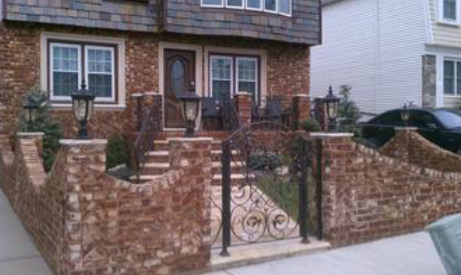 decorative fencing and walkway installed by pavers