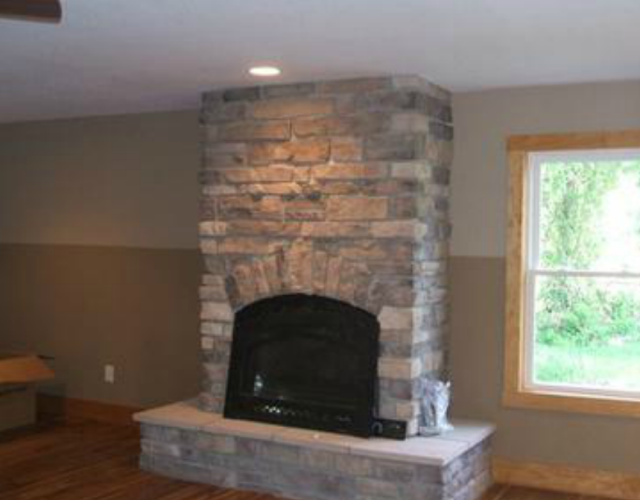 culture stone fireplace designed and installed by pavers