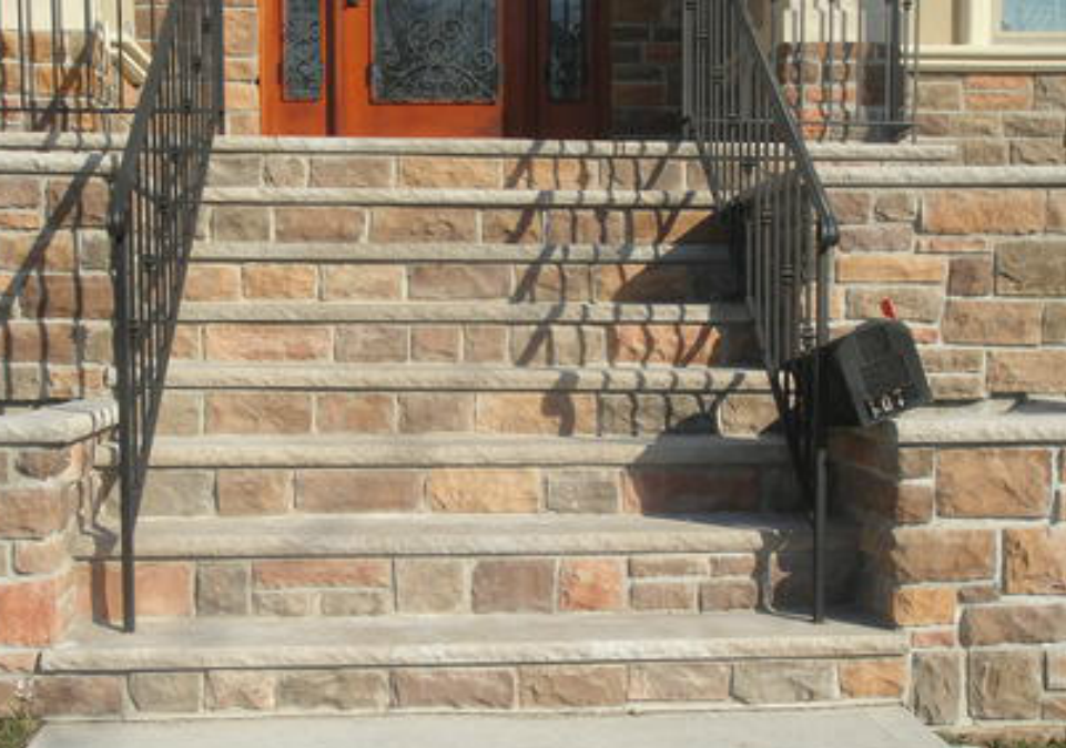 cultured stone stairway in front of house installed by pavers