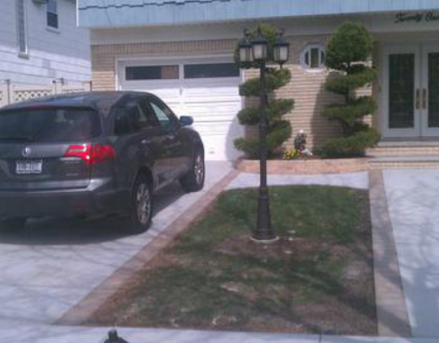 cement driveway and walkway paved by pavers