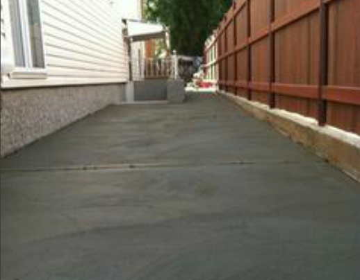 cement driveway paved by pavers
